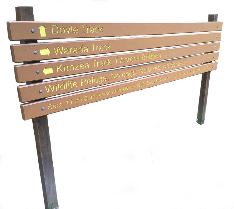 Signage stating track names and directions